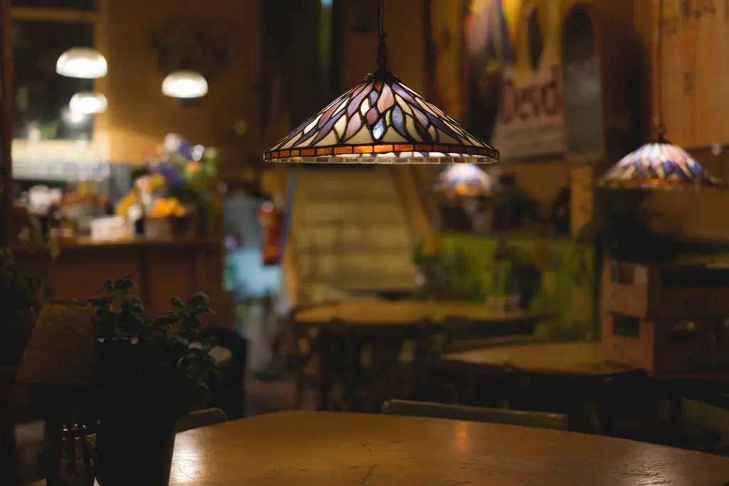 Cozy restaurant interior with set tables in warm light